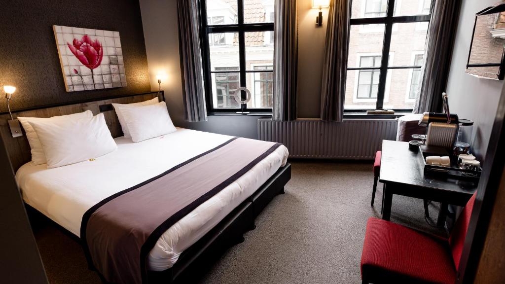 Postel nebo postele na pokoji v ubytování B&B 't Poorthuys