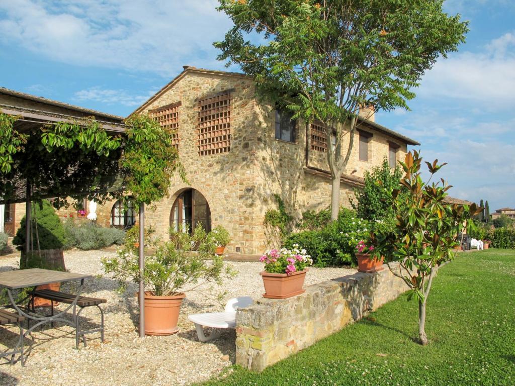 a stone house with potted plants in front of it at Holiday Home Linearis J by Interhome in SantʼAppiano