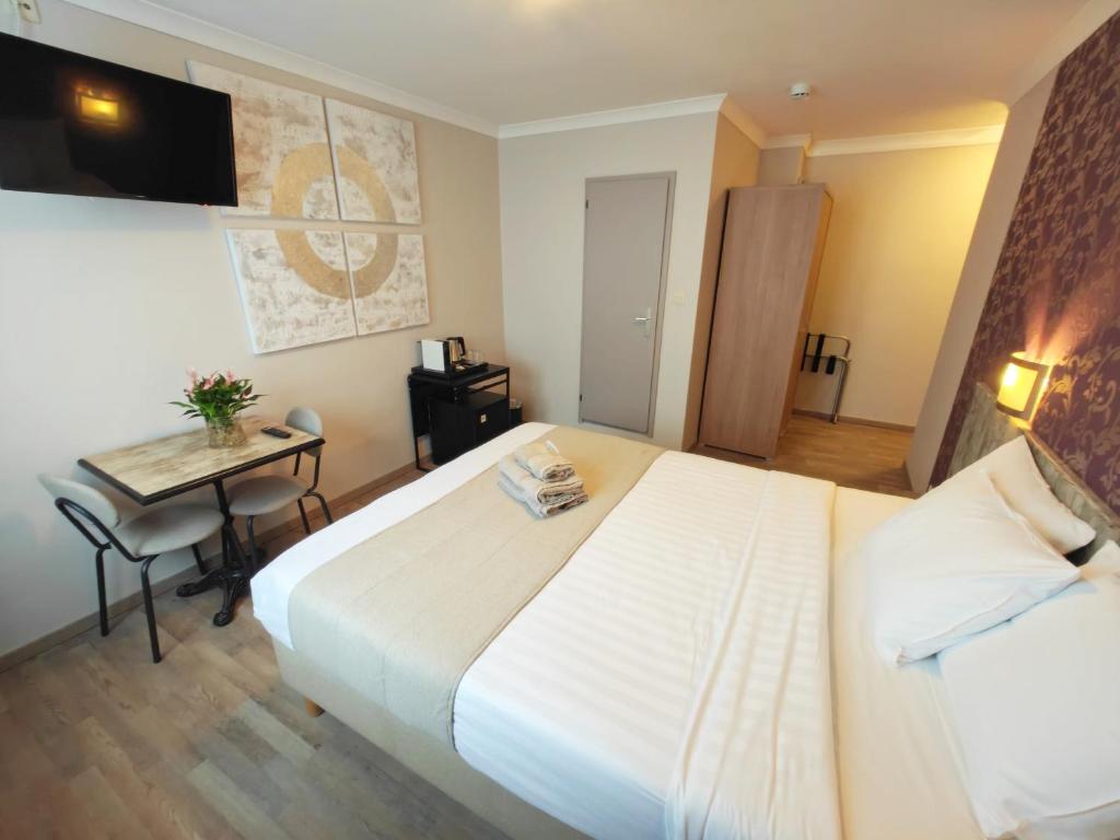 Postel nebo postele na pokoji v ubytování Hotel Tropicana
