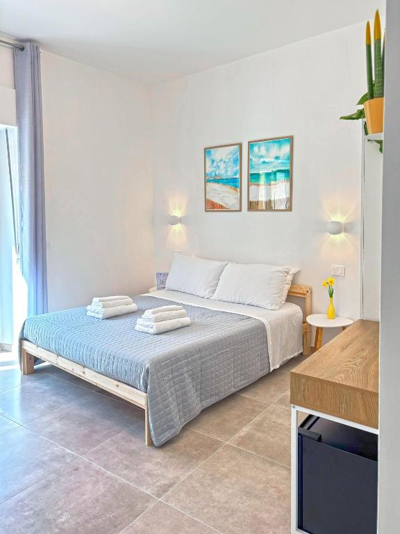 Postel nebo postele na pokoji v ubytování NEMO BnB ALGHERO CENTRE