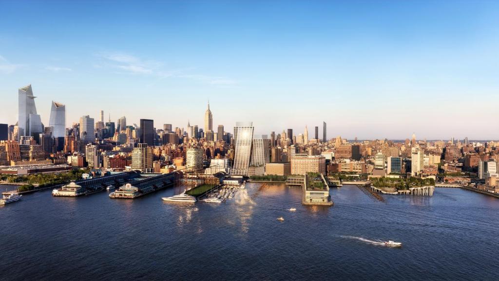 an aerial view of a city with boats in the water at Faena New York in New York
