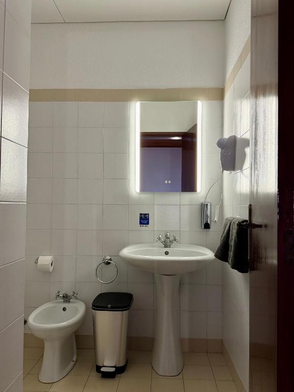 Koupelna v ubytování Habitación con estacionamiento