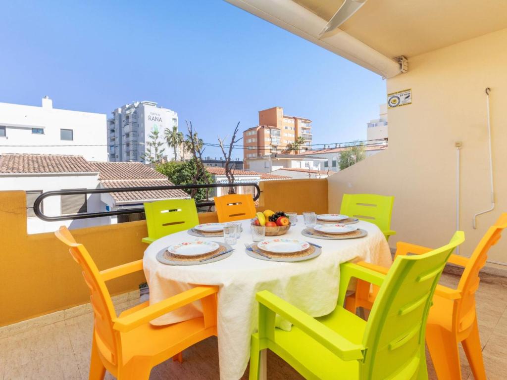 a dining room with a table and chairs on a balcony at Apartment Portofino IV by Interhome in Oropesa del Mar