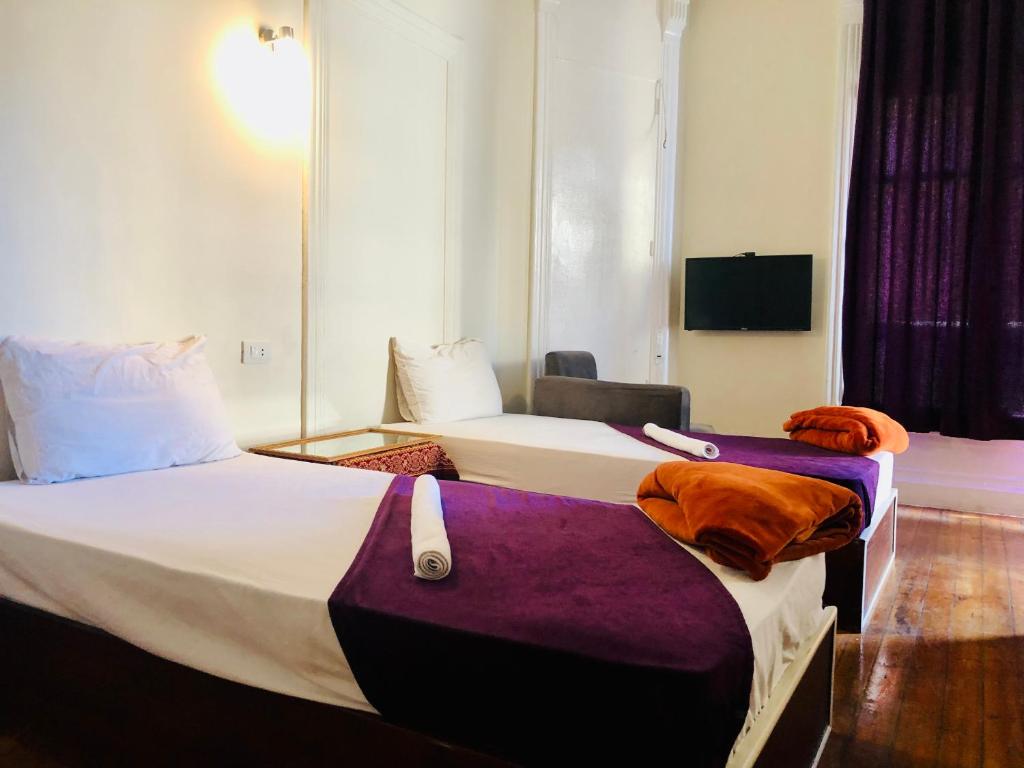Postel nebo postele na pokoji v ubytování Mesho Cairo Hostel