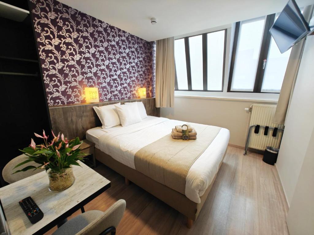 Postel nebo postele na pokoji v ubytování Hotel Tropicana