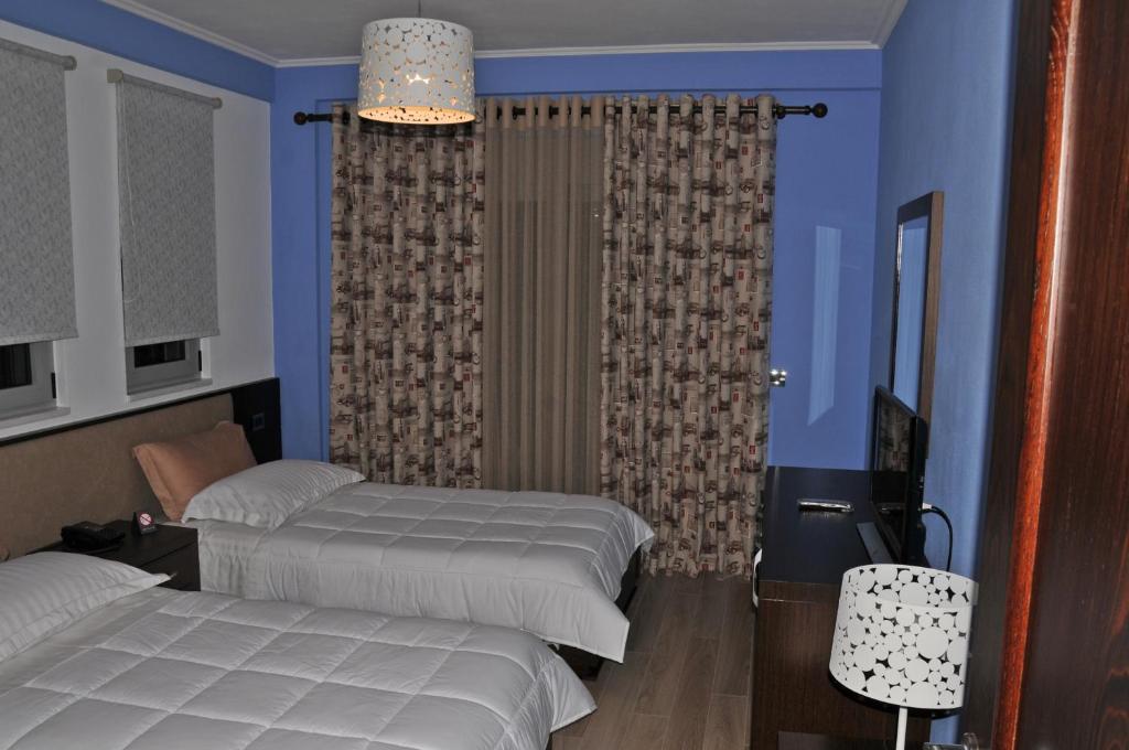 Postel nebo postele na pokoji v ubytování Dream's Hotel