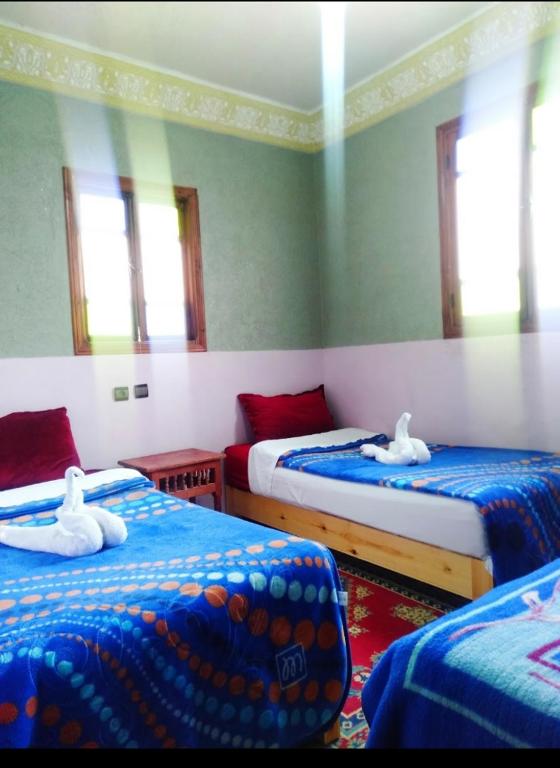 Postel nebo postele na pokoji v ubytování Gîte akioud mazik