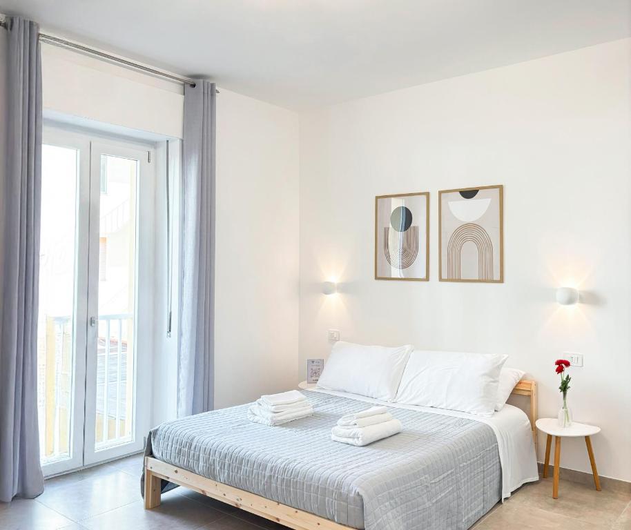 Postel nebo postele na pokoji v ubytování NEMO BnB ALGHERO CENTRE