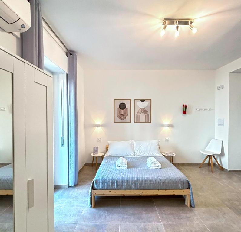 Postel nebo postele na pokoji v ubytování NEMO BnB ALGHERO CENTRE