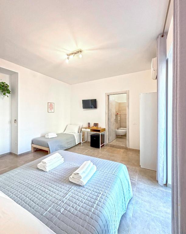 Postel nebo postele na pokoji v ubytování NEMO BnB ALGHERO CENTRE