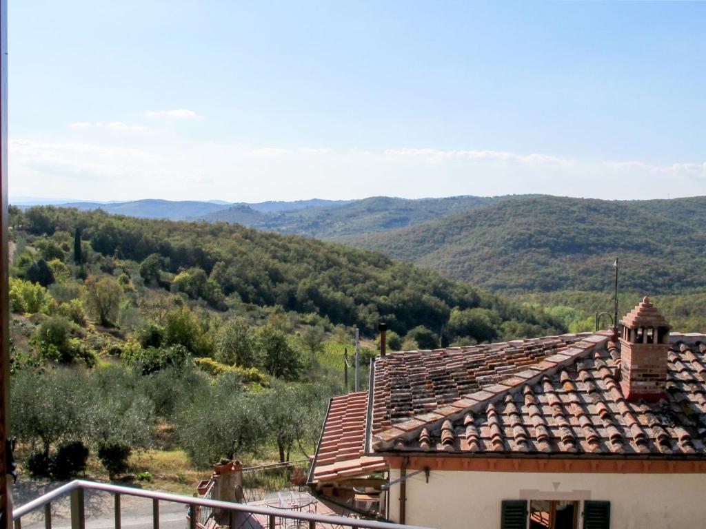 a view of a house with mountains in the background at Holiday Home Montechioccioli-4 by Interhome in Gaiole in Chianti