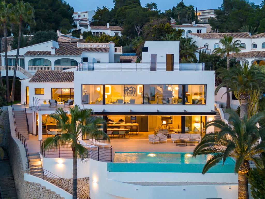 a villa with a swimming pool at dusk at Villa Cabo de Gata by Interhome in Moraira