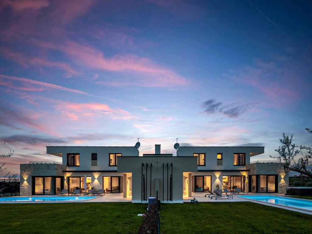a large house with a pool in front of it at Villa Stella & Alba by Interhome in Brtonigla