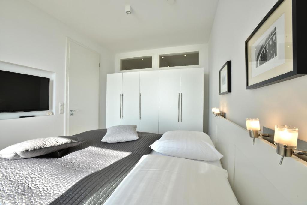 Postel nebo postele na pokoji v ubytování Penthouse Ostseeresidenz