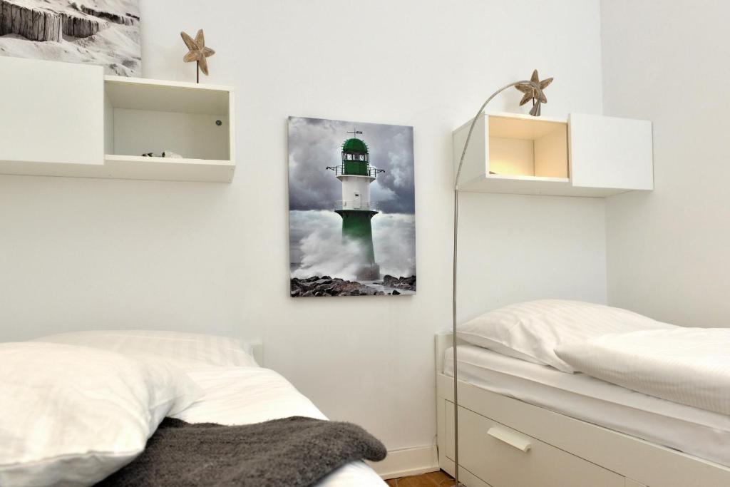 Postel nebo postele na pokoji v ubytování Penthouse Ostseeresidenz