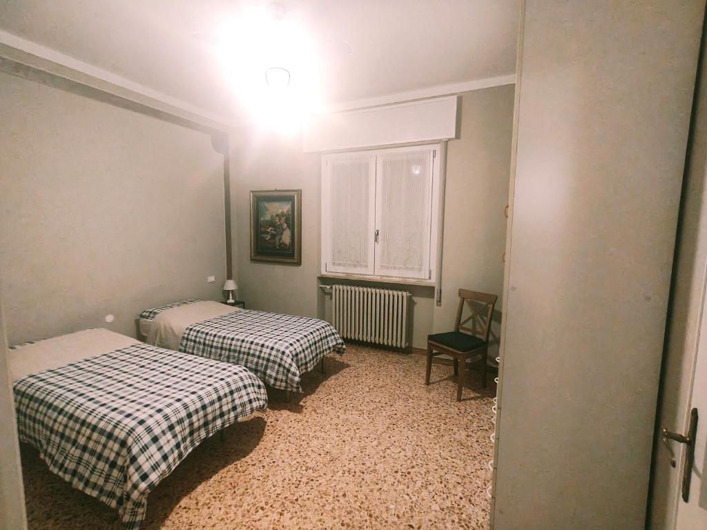 Postel nebo postele na pokoji v ubytování Le Aquile