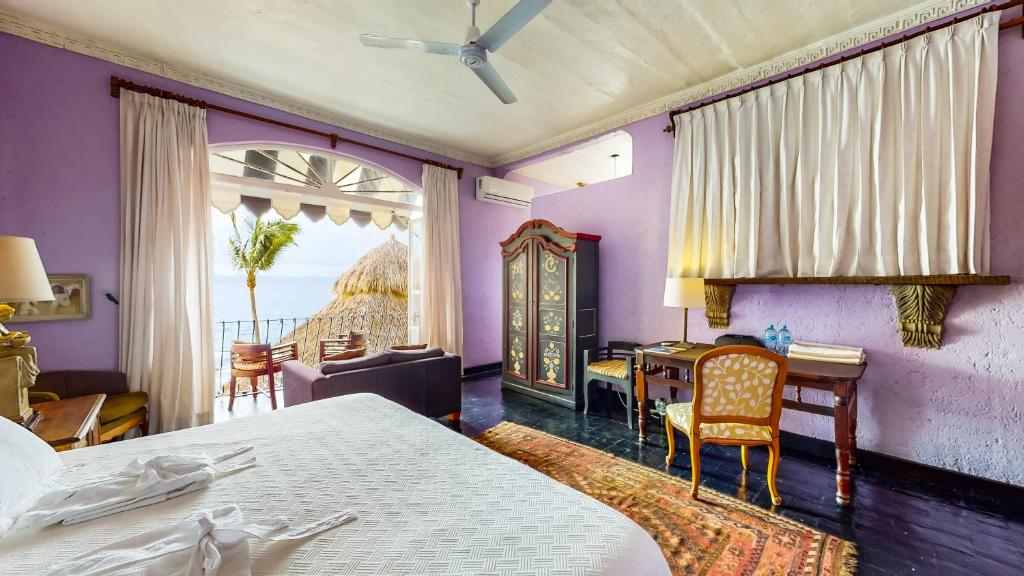 Postel nebo postele na pokoji v ubytování Quinta Maria Cortez Beach Hotel