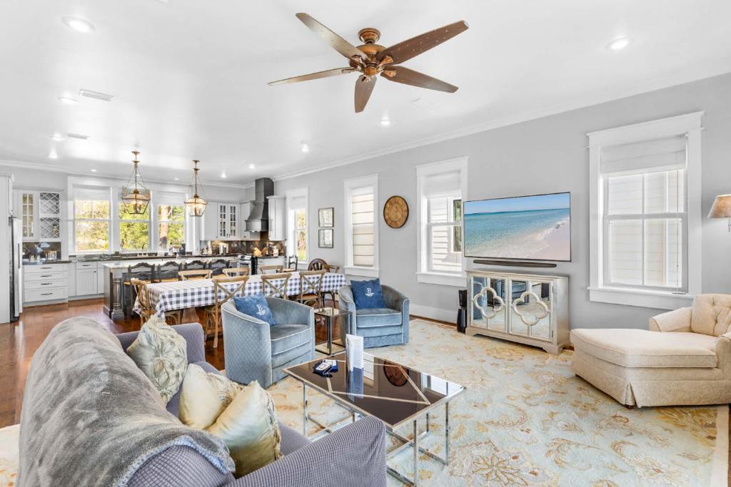 a living room with a couch and a tv at Narnia Grande Pointe Villa - Inlet Beach Pool & Clubhouse Access in Inlet Beach