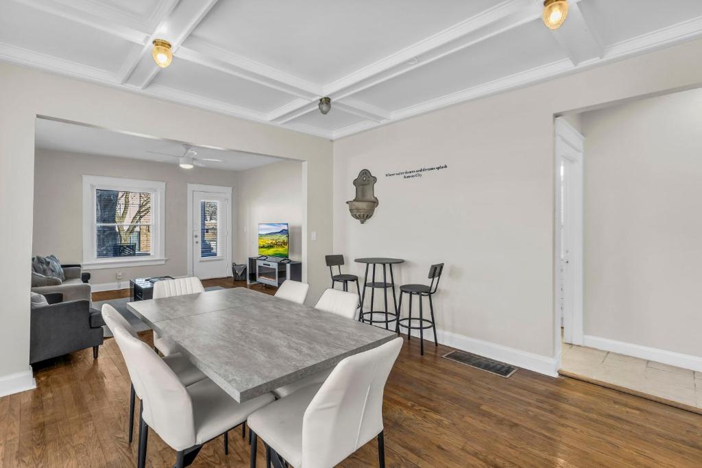 a dining room with a table and chairs at City of Fountains Getaway in Kansas City