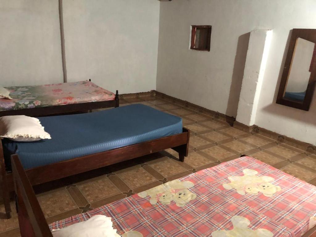Postel nebo postele na pokoji v ubytování Rancho Ña Ignacia Nueva Colombia