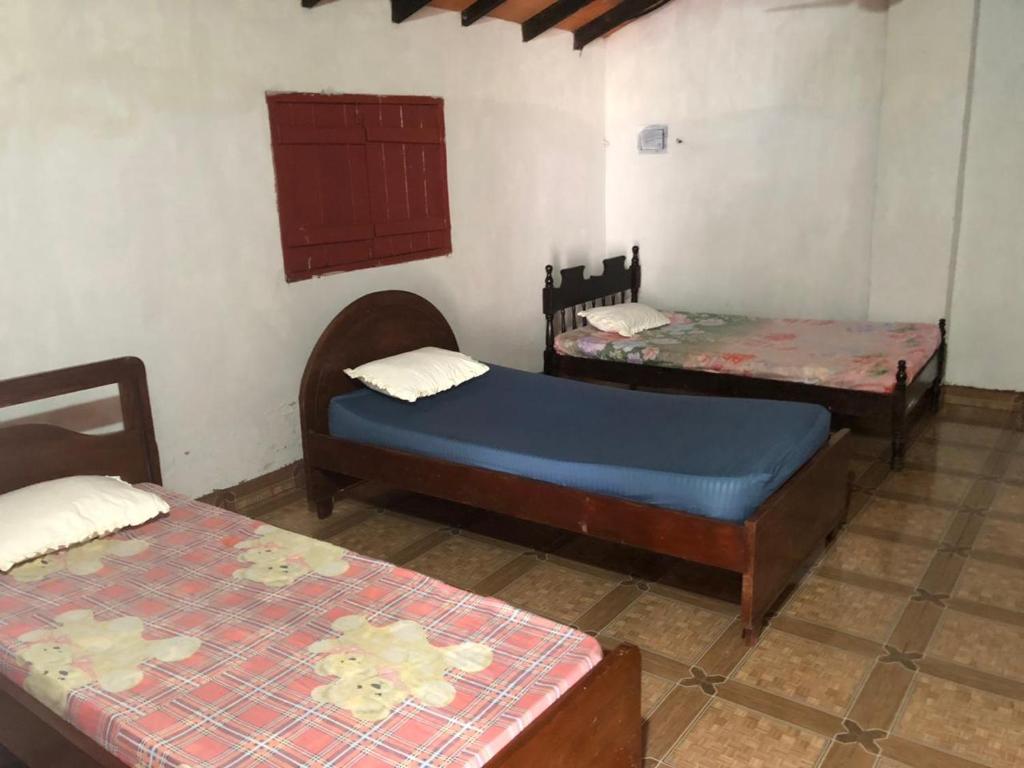 Postel nebo postele na pokoji v ubytování Rancho Ña Ignacia Nueva Colombia