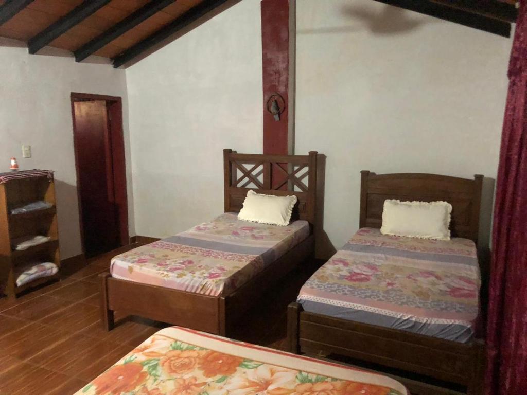 Postel nebo postele na pokoji v ubytování Rancho Ña Ignacia Nueva Colombia