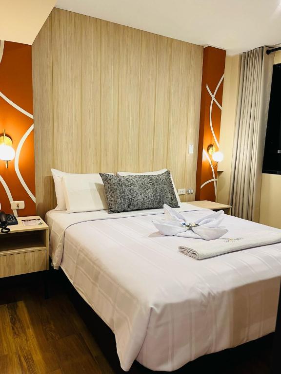 Postel nebo postele na pokoji v ubytování LOS ARCES HOTEL