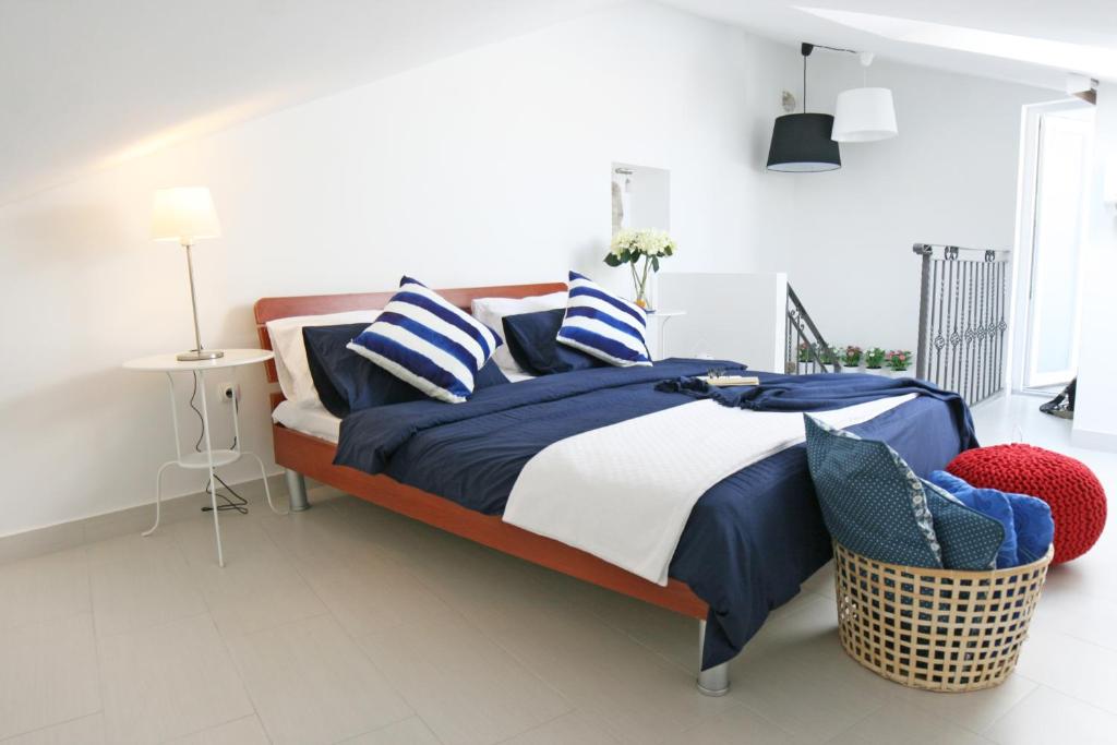 Postel nebo postele na pokoji v ubytování Apartments Stefani