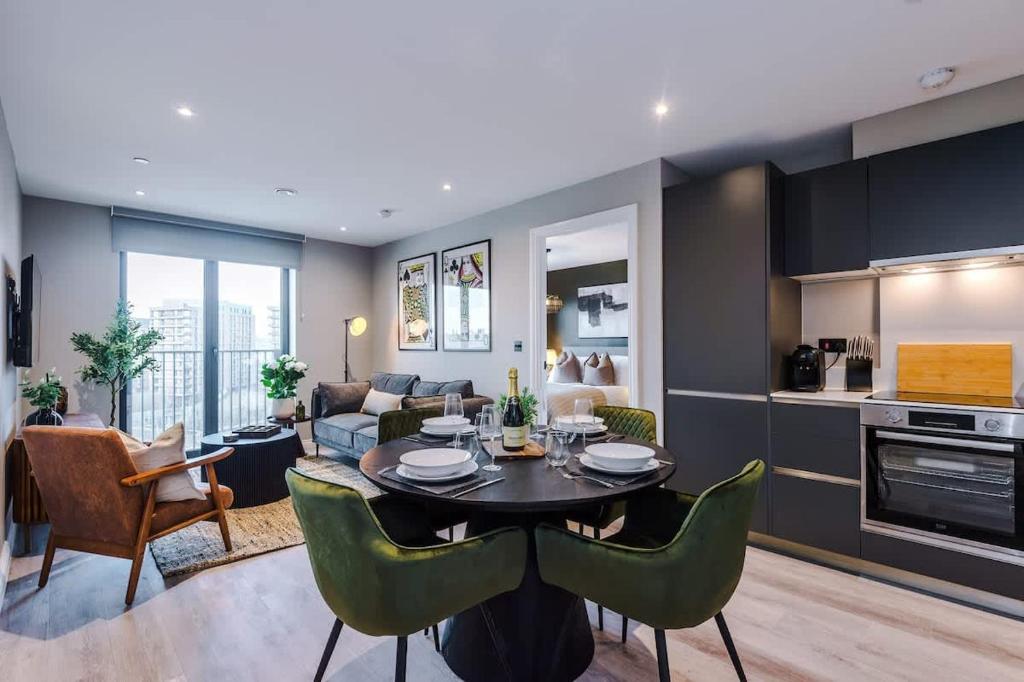 a kitchen and living room with a table and chairs at Leeds City Centre - Luxury 2 Bed - Free Parking in Leeds
