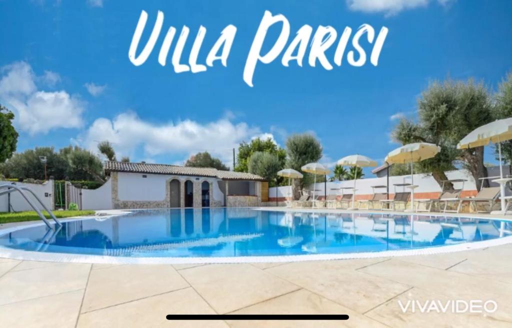 a swimming pool at a hotel with the words una parks at Villa Parisi in Floridia