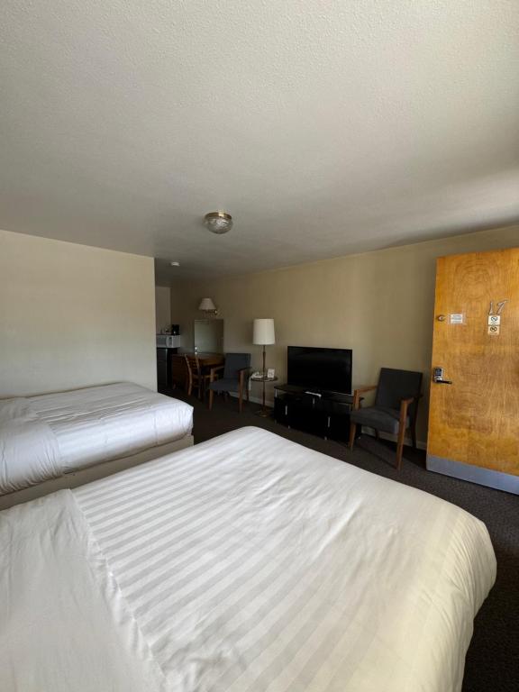 Postel nebo postele na pokoji v ubytování Sage Motel