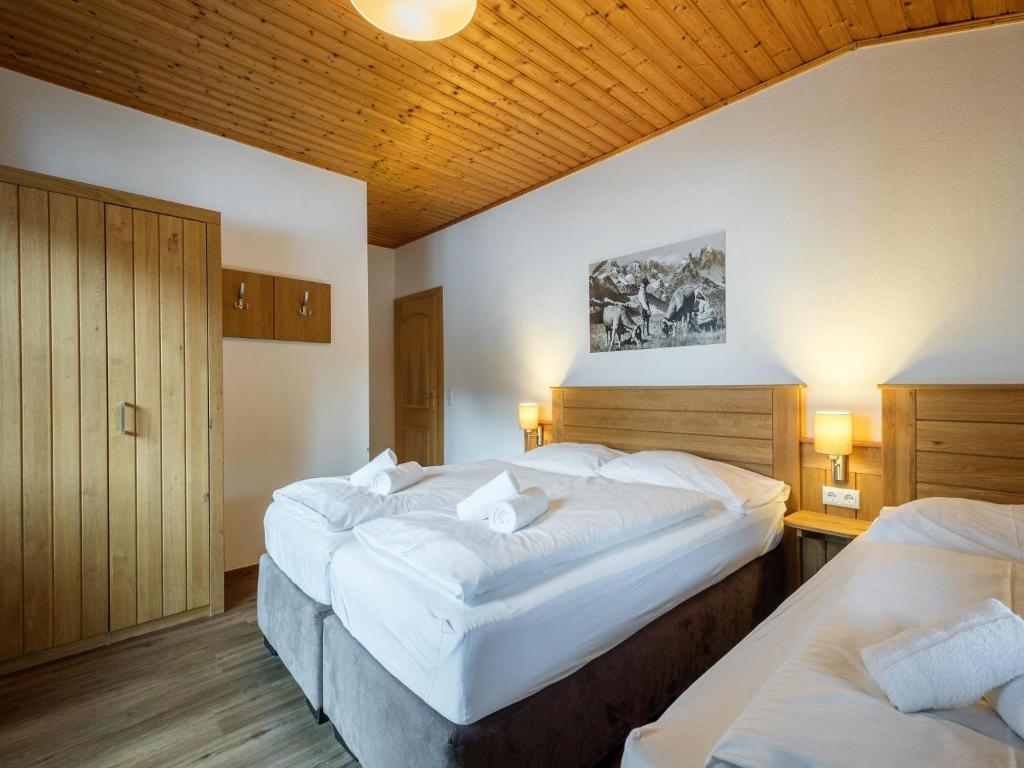 Posteľ alebo postele v izbe v ubytovaní Alpensteinbock Saalbach