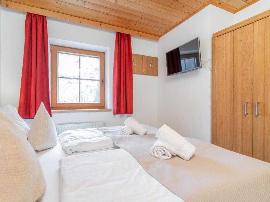 Posteľ alebo postele v izbe v ubytovaní Alpensteinbock Saalbach