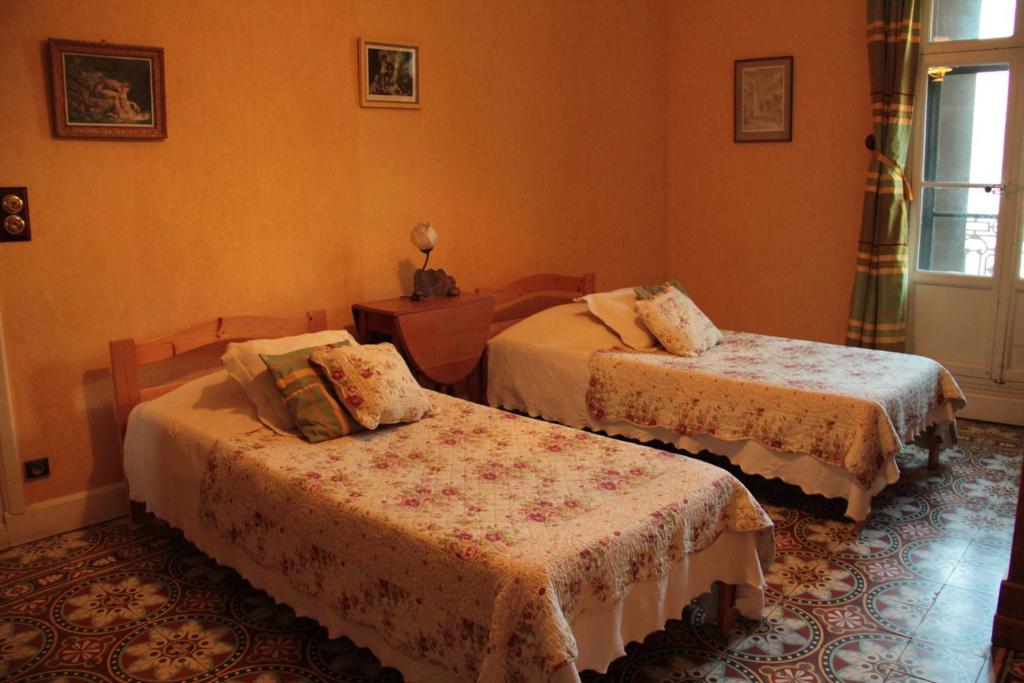 Letto o letti in una camera di Anges Gardiens