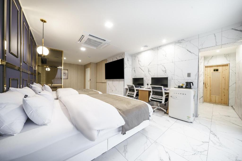 Postel nebo postele na pokoji v ubytování Hotel MARIA