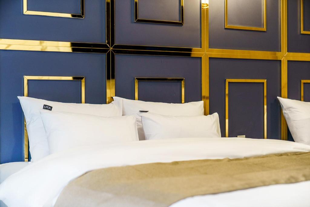 Postel nebo postele na pokoji v ubytování Hotel MARIA