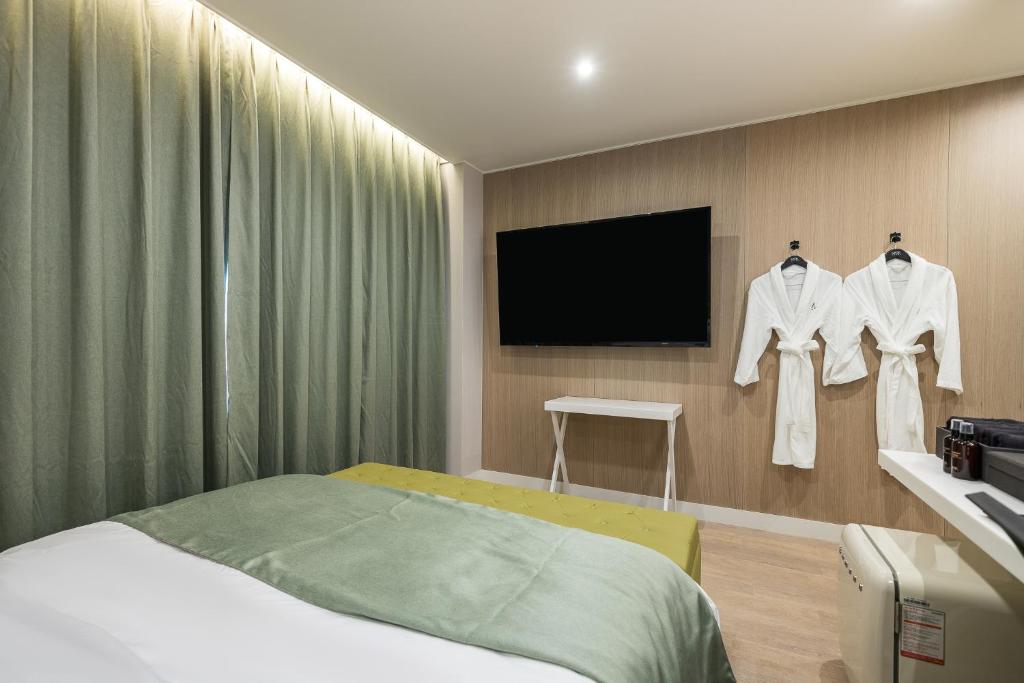 Postel nebo postele na pokoji v ubytování Hotel MARIA