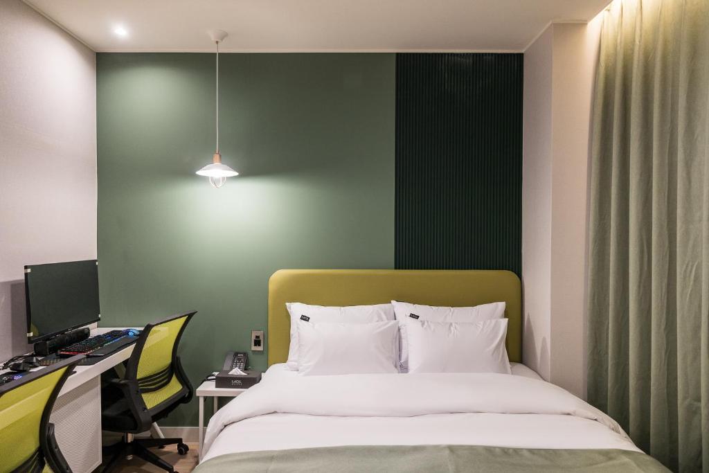 Postel nebo postele na pokoji v ubytování Hotel MARIA