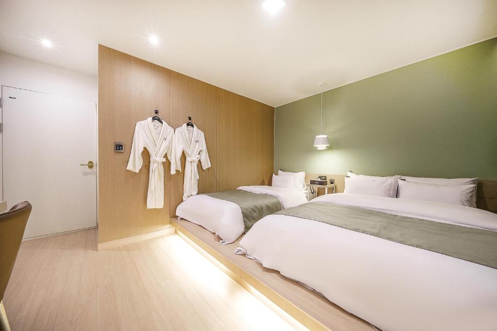 Postel nebo postele na pokoji v ubytování Hotel MARIA