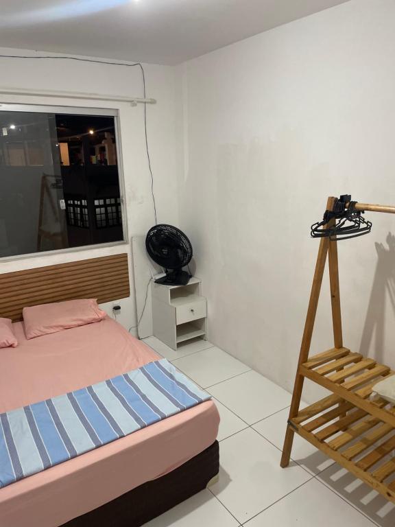 Pousada hostel praia itapuaにあるベッド