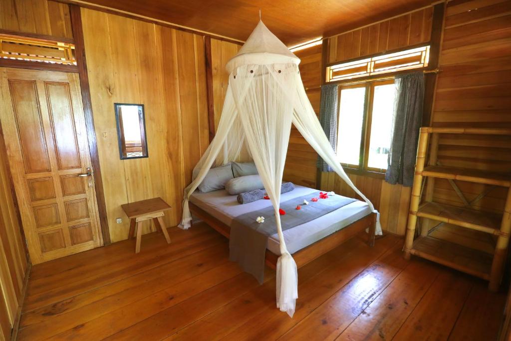 Postel nebo postele na pokoji v ubytování Pulisan Resort