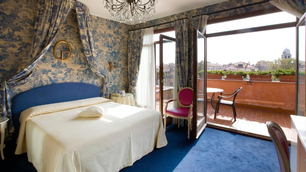 Postel nebo postele na pokoji v ubytování Hotel Principe
