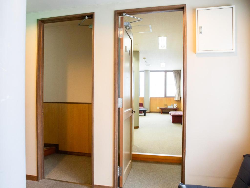 Postel nebo postele na pokoji v ubytování バードランド