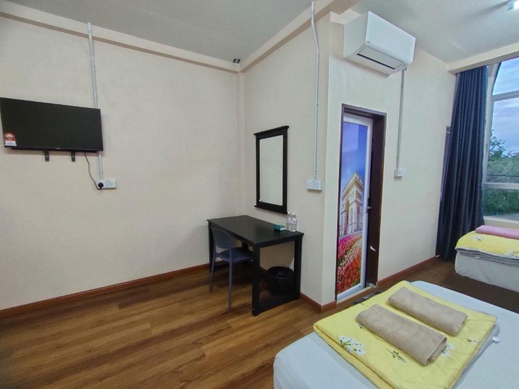 Postel nebo postele na pokoji v ubytování RS INN
