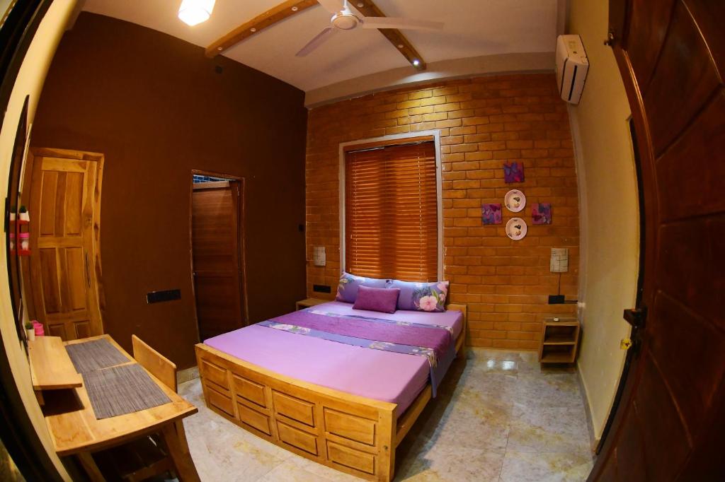 Postel nebo postele na pokoji v ubytování Ammu villa