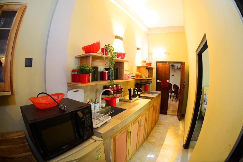 Kuchyň nebo kuchyňský kout v ubytování Ammu villa