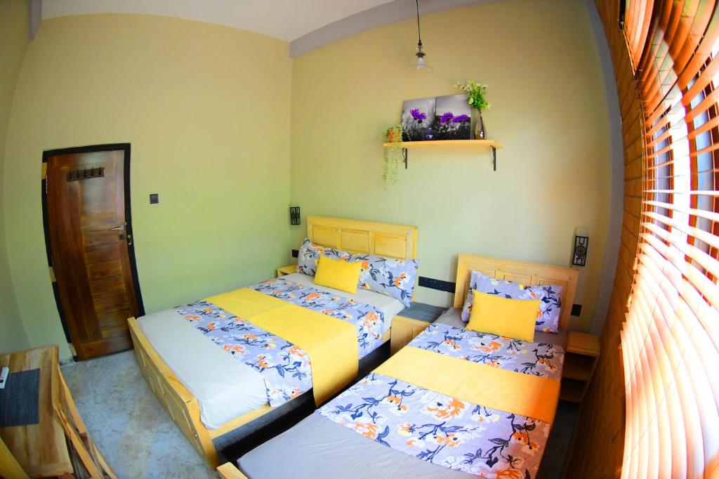 Postel nebo postele na pokoji v ubytování Ammu villa