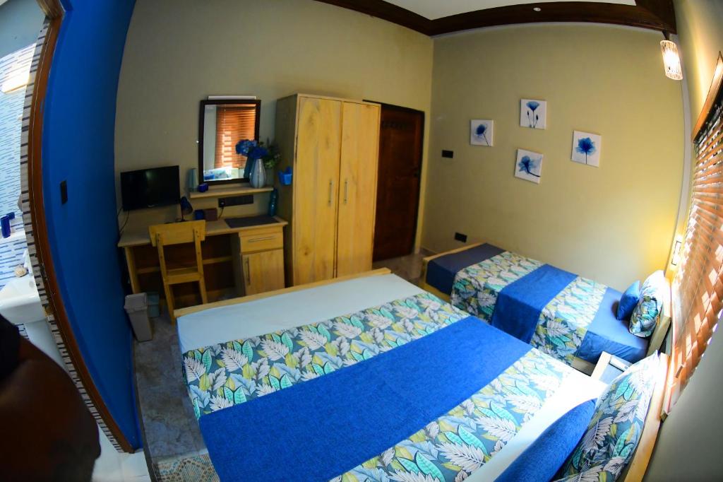Postel nebo postele na pokoji v ubytování Ammu villa