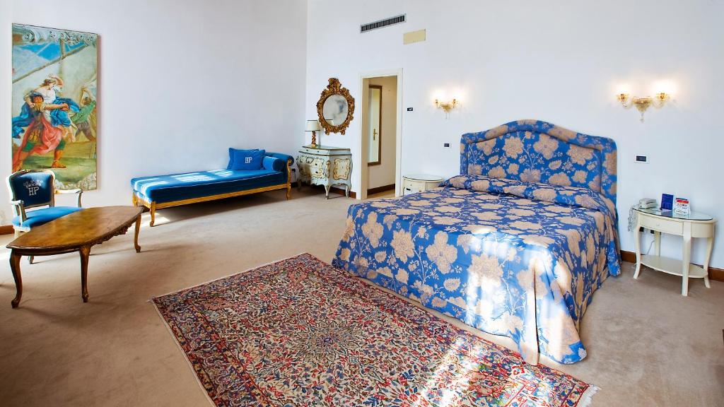Postel nebo postele na pokoji v ubytování Hotel Principe