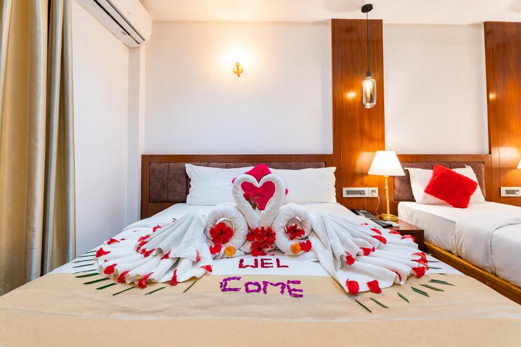 Postel nebo postele na pokoji v ubytování Hotel Seven Limited